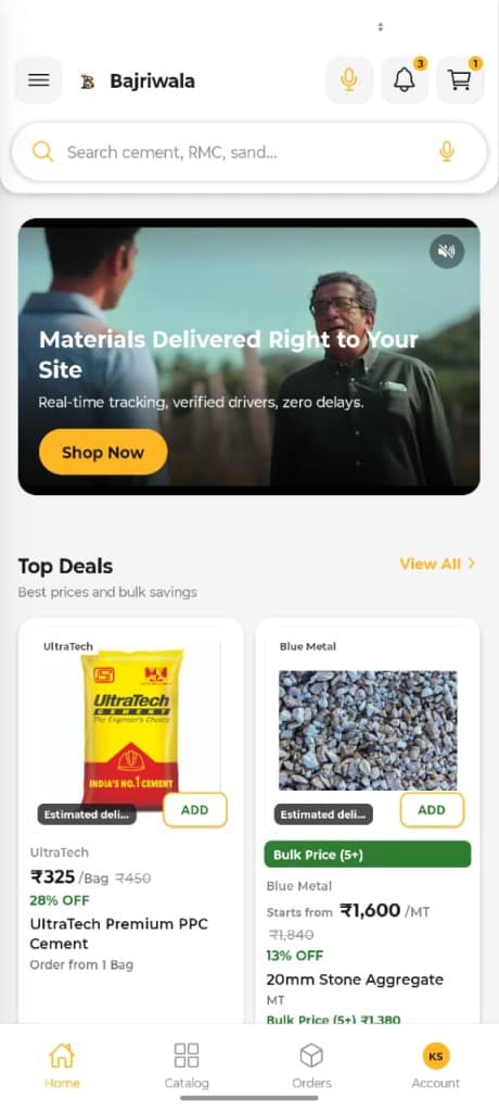 Bajriwala app home screen showing top deals with cement and stone aggregate product cards, prices, discounts and bulk pricing