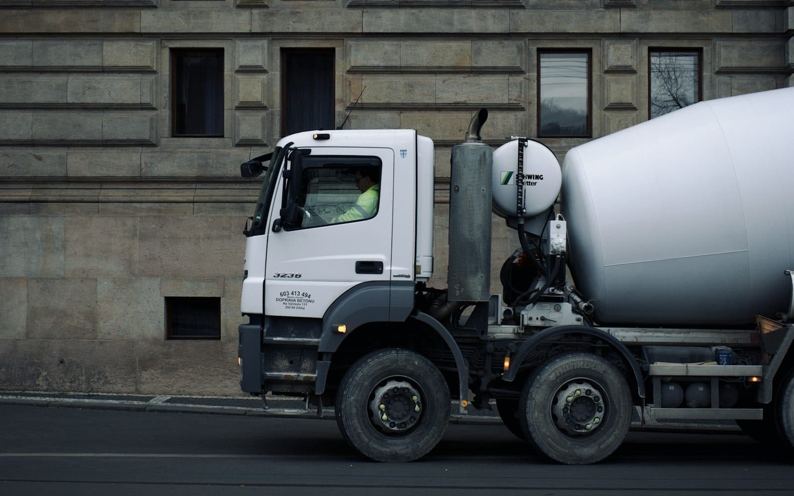 Ready-mix concrete transit mixer on the road to a delivery site